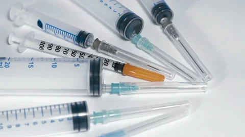 Assorted syringe turning close up Video stock 33731945