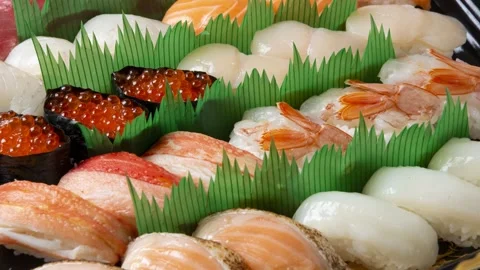 Assorted Takeout Sushi Selection, Green Grass Display Stock Footage 340550217