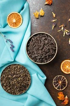 Assorted tea and citrus chips on a dark background top view. Stock Photos