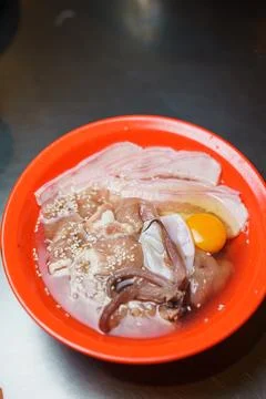 Assorted Thai BBQ Set with Marinated Pork Slices, Fresh Squid and Raw Egg i.. 库存照片