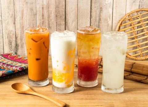 Assorted Thai Iced Drinks Ice Thai Milk Tea, Creamy Mango Milk iced Tea, Sp.. Stock Photos