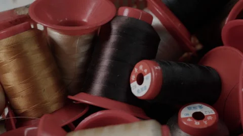 Assorted Thread Spools in Basket at Shoe Manufacturing Factory Closeup 库存影片 341667778
