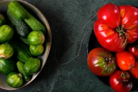 Assorted tomatoes and cucumbers of different colors and sizes Stock-Fotos