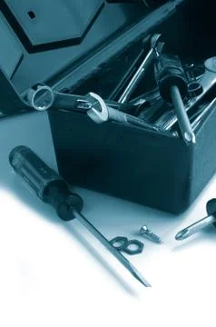 Assorted tools in and around a toolbox Stock Photos