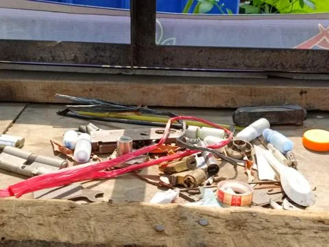 Assorted Tools and Hardware on a Wooden Workbench Stock Photos