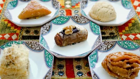 Assorted Traditional Arabic Sweets And Pastries On Plates Stock Footage 335042171