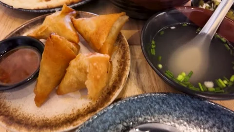 Assorted Traditional Burmese Food Spread on Restaurant Table Stock Footage 345486302