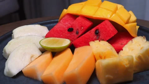 Assorted tropical fruits including mango, watermelon, guava, lime, Видео 280020722