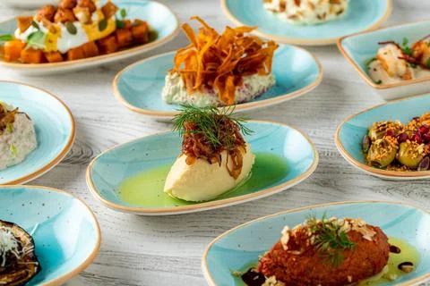 Assorted turkish meze plates served in a modern restaurant setting Stock Photos