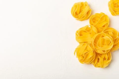 Assorted uncooked pasta in bowls Stock Photos