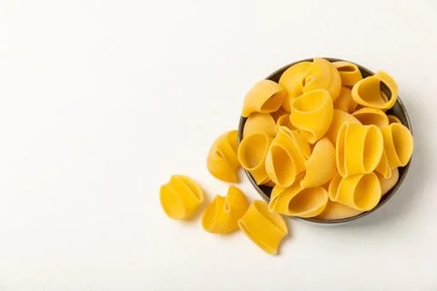 Assorted uncooked pasta in bowls Stock Photos