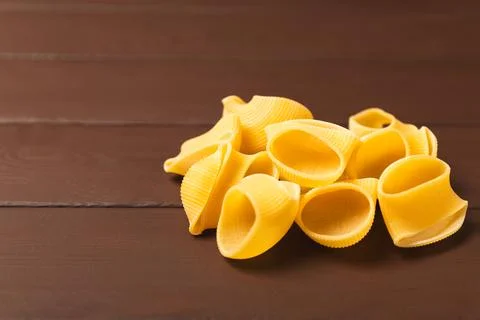 Assorted uncooked pasta in bowls Stock Photos