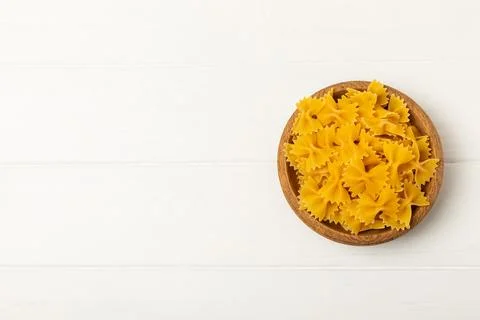 Assorted uncooked pasta in bowls Stock Photos