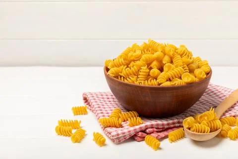 Assorted uncooked pasta in bowls Stock Photos