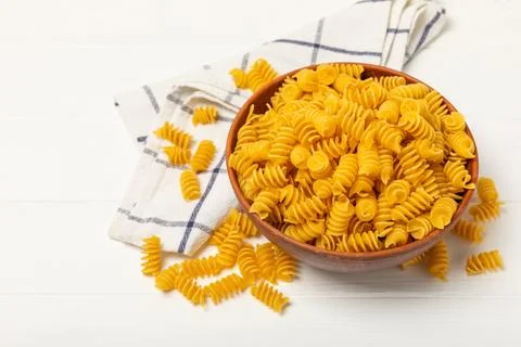 Assorted uncooked pasta in bowls Stock Photos