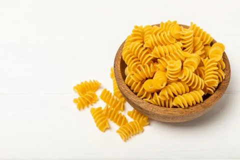 Assorted uncooked pasta in bowls Stock Photos