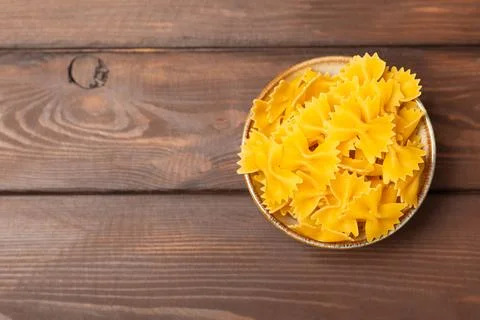 Assorted uncooked pasta in bowls Stock Photos