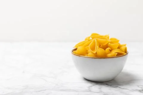 Assorted uncooked pasta in bowls. Stock Photos