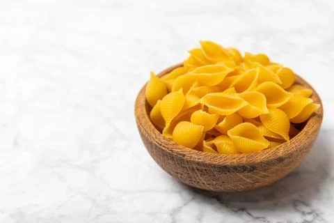 Assorted uncooked pasta in bowls. Stock Photos