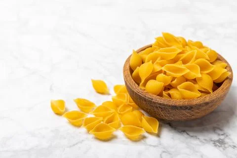 Assorted uncooked pasta in bowls. Stock Photos
