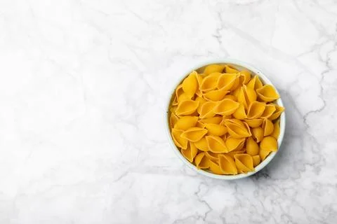 Assorted uncooked pasta in bowls. Stock Photos