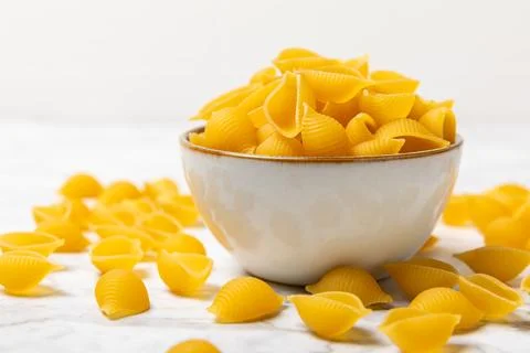 Assorted uncooked pasta in bowls. Stock Photos