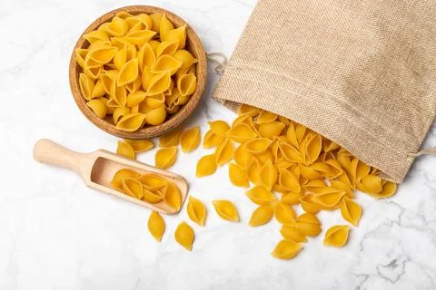 Assorted uncooked pasta in bowls. Stock Photos