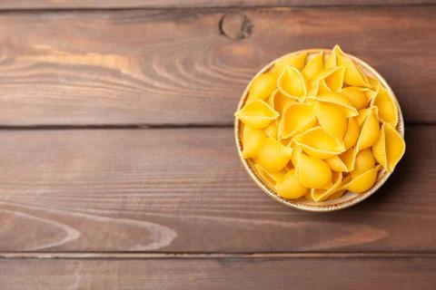 Assorted uncooked pasta in bowls. Stock Photos