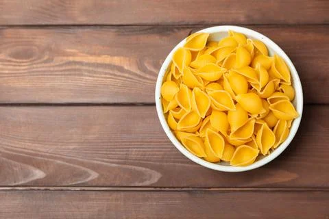 Assorted uncooked pasta in bowls. Stock Photos