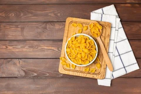 Assorted uncooked pasta in bowls. Stock Photos
