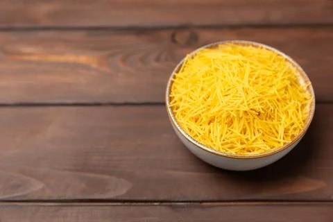 Assorted uncooked pasta in bowls. Stock Photos