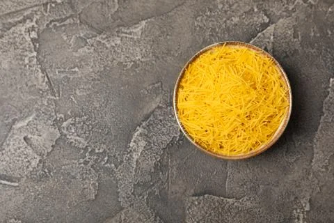 Assorted uncooked pasta in bowls. Stock Photos