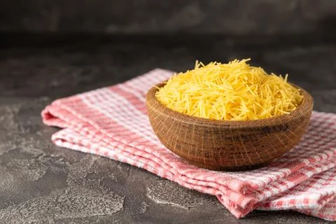 Assorted uncooked pasta in bowls. Stock Photos