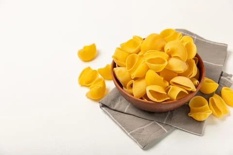 Assorted uncooked pasta in bowls. Stock Photos