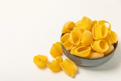 Assorted uncooked pasta in bowls. Stock Photos