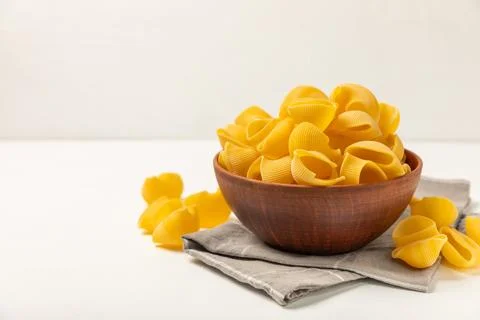 Assorted uncooked pasta in bowls. Stock Photos