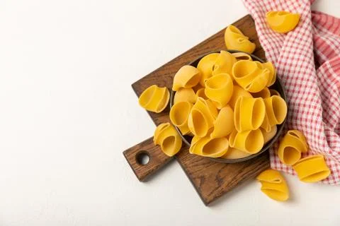Assorted uncooked pasta in bowls. Stock Photos