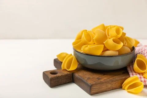 Assorted uncooked pasta in bowls. Stock Photos