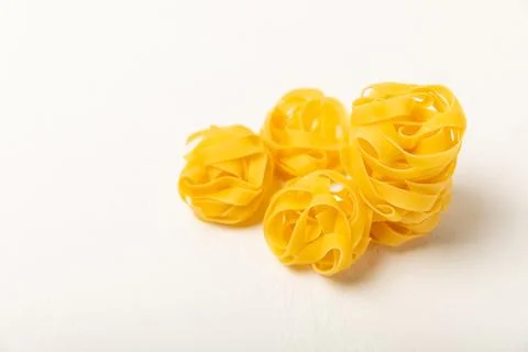 Assorted uncooked pasta in bowls. Stock Photos