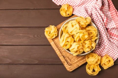 Assorted uncooked pasta in bowls. Stock Photos
