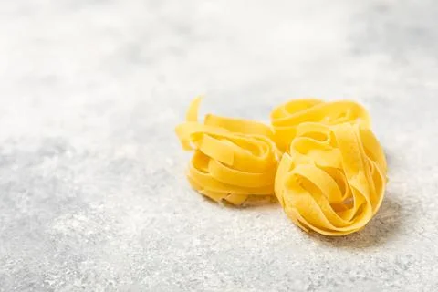 Assorted uncooked pasta in bowls. Stock Photos