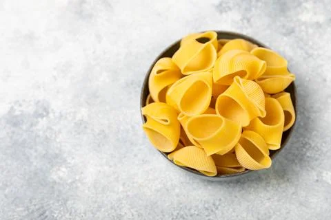Assorted uncooked pasta in bowls. Stock Photos
