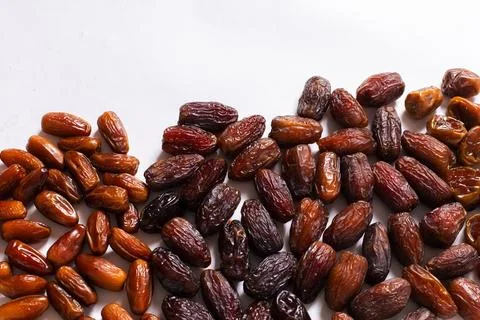 Assorted Varieties of Dates on White Background Stock Photos