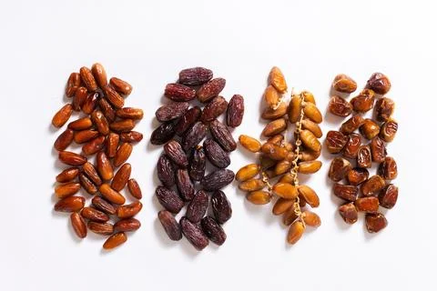 Assorted Varieties of Dates on White Background Stock Photos