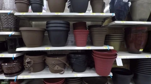 Assorted variety of flower pots on store shelves Stock Footage 75249717