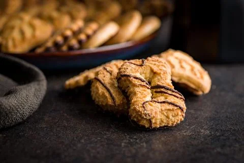 Assorted various cookies. Sweet biscuits  on black table. Foto stock