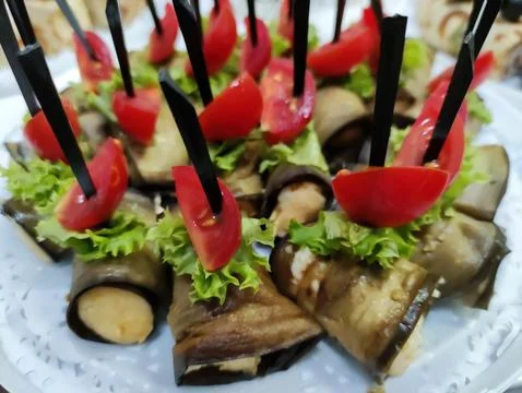 Assorted vegetable appetizers with tomato garnish on platter 스톡 사진