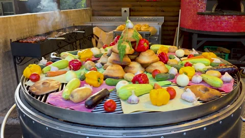 Assorted Vegetables and Bread Cooking on Outdoor Grill Stock Footage 319826498