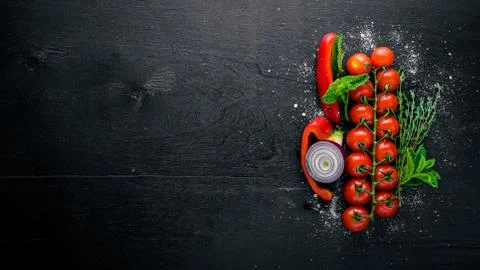 Assorted vegetables and cherry tomatoes on Wooden background. Top view. Free  Stock Photos