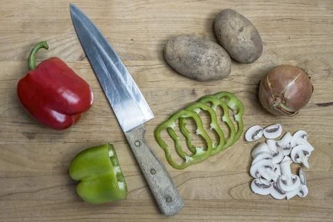 Assorted vegetables and a knife. Stock Photos